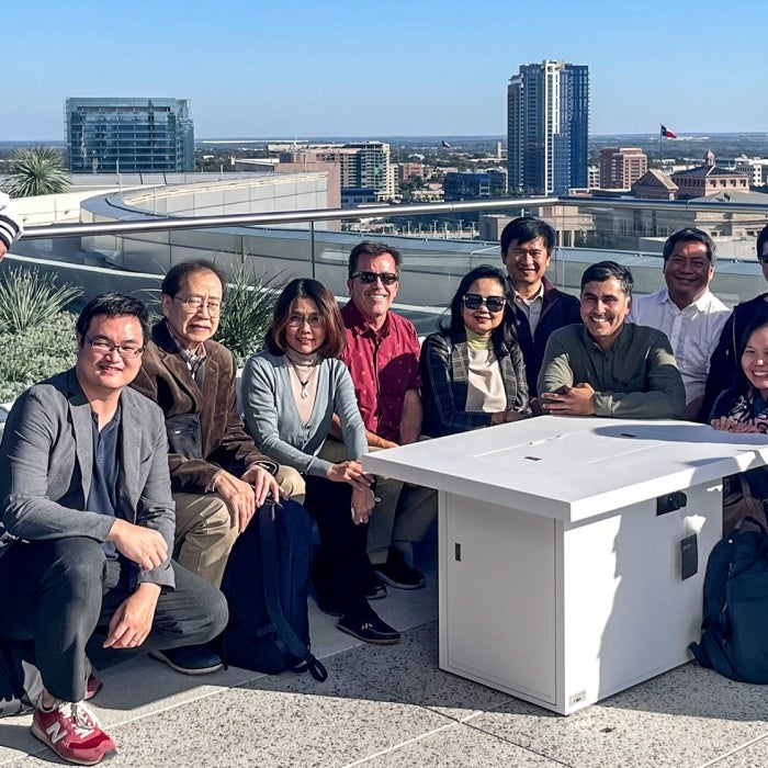 GIL group with the Austin city skyline in the background