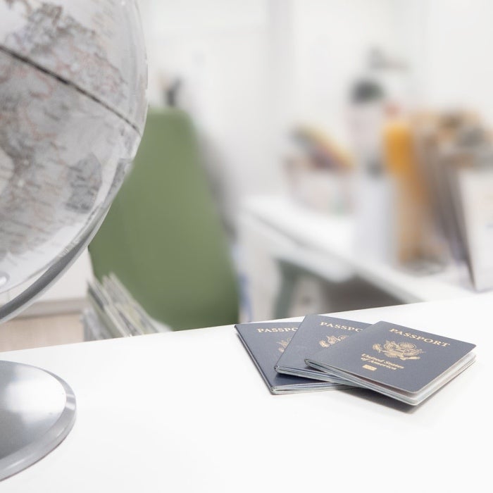 The Texas Global Passport office with globe and passports on the front desk