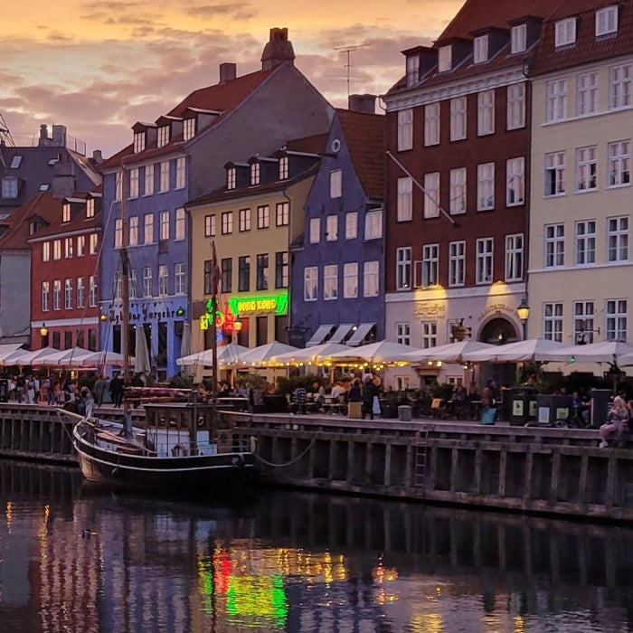 Colorfol historic homes, businesses, and ships line the Nyhavn Canal in Copenhagen, Denmark