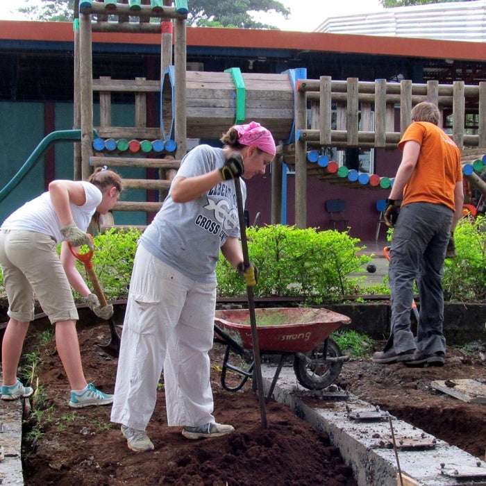Members of UT participate in a community exterior renovation project