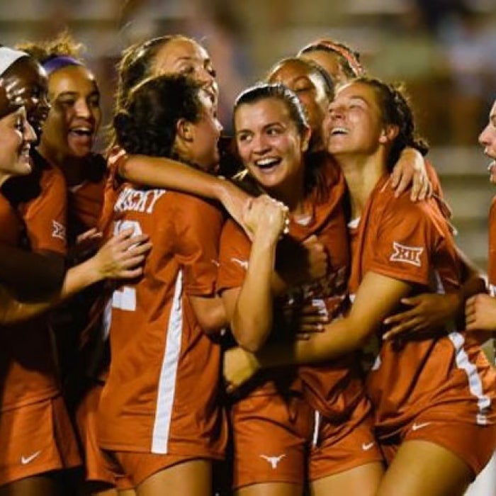 Female Longhorns celebrate in UT women's soccer