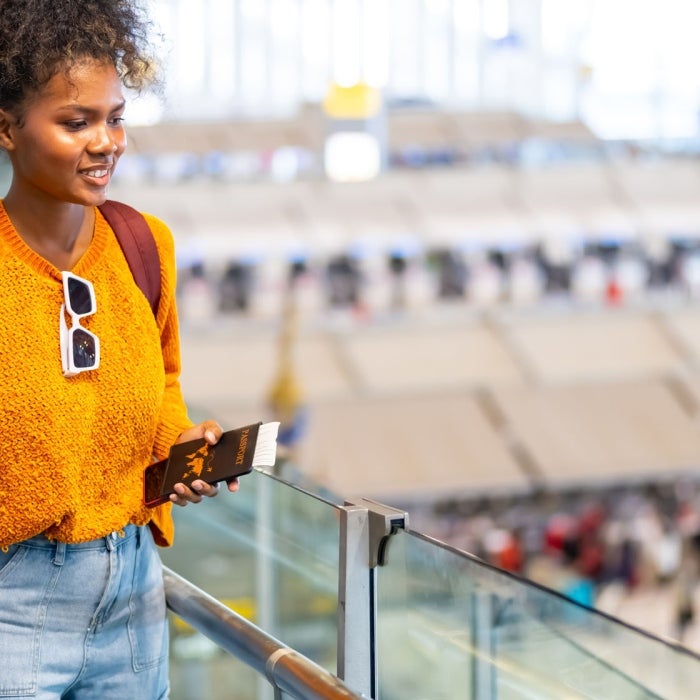 A female traveler traverses an airport