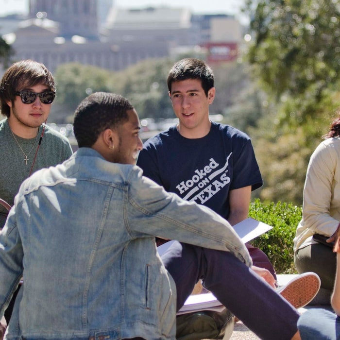 Smiling students gather on the south lawn