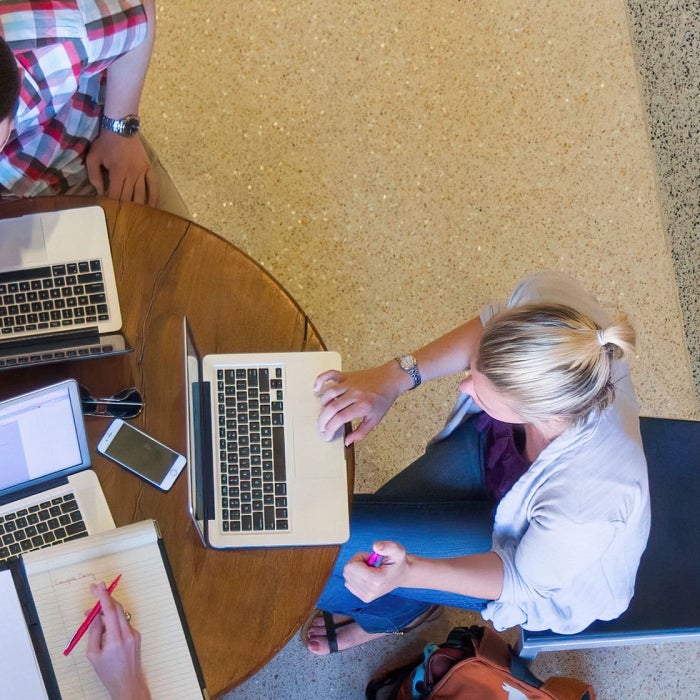 An aerial view of students on computers