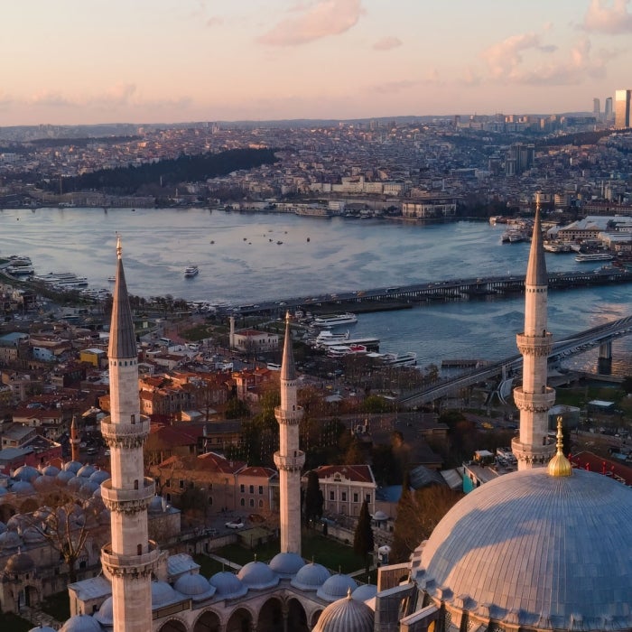 Aerial view of Suleymaniye Mosque, the river, and the city of Istanbul Turkey during sunset