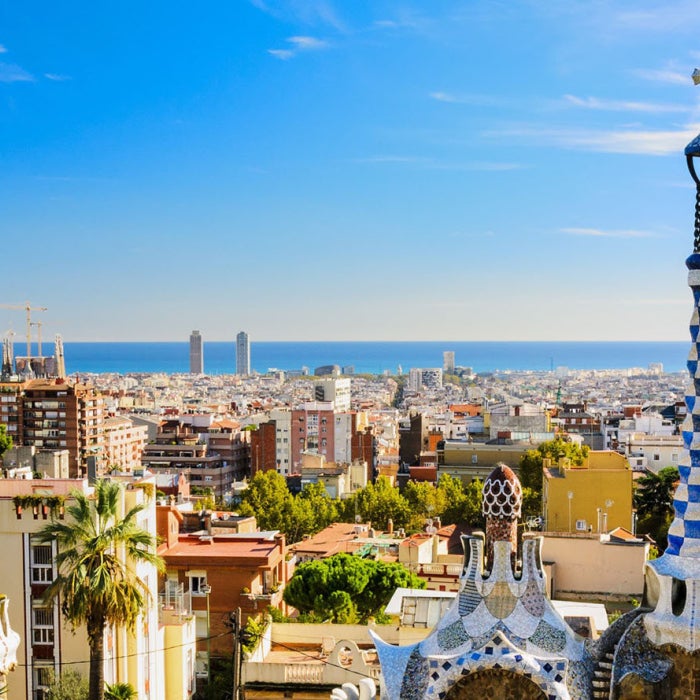 Panoramic view of the colorful city of Barcelona, Spain backdropped by blue skies during the day