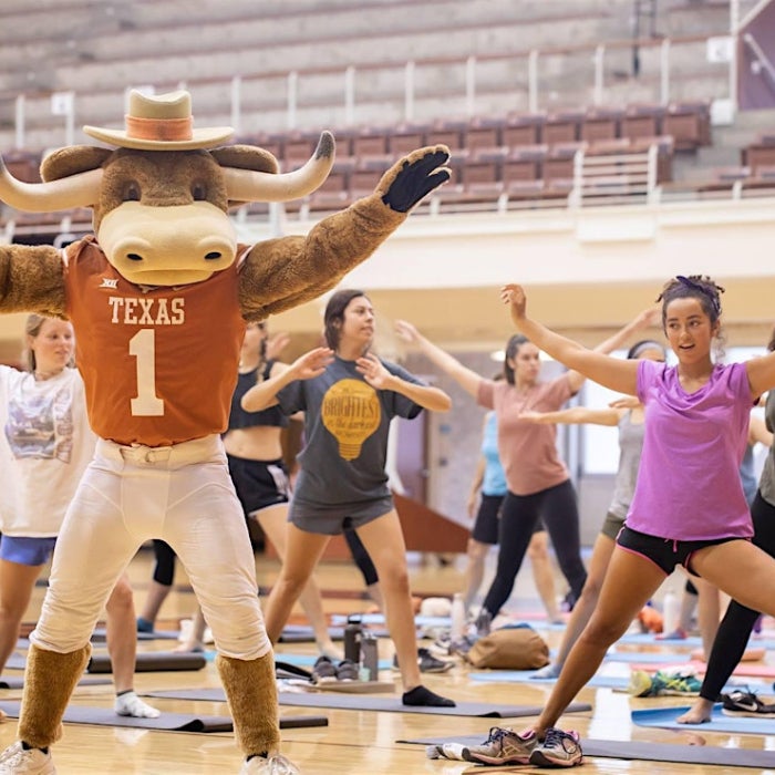 Hook 'Em Participating in Mat Pilates with Students
