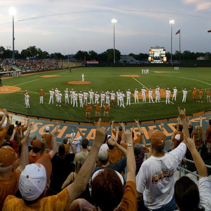 Students and fans cheer on the UT men's baseball team at the UFCU Disch-Falk Field during the evening