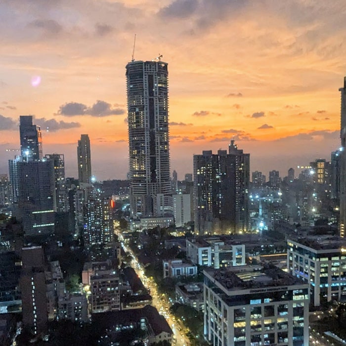 The city skyline of Mumbai, India during sunset at twilight