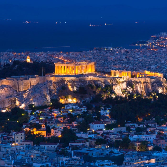 The Acroplis and the city of Athens, Greece are seen illuminated during the blue hour of twilight
