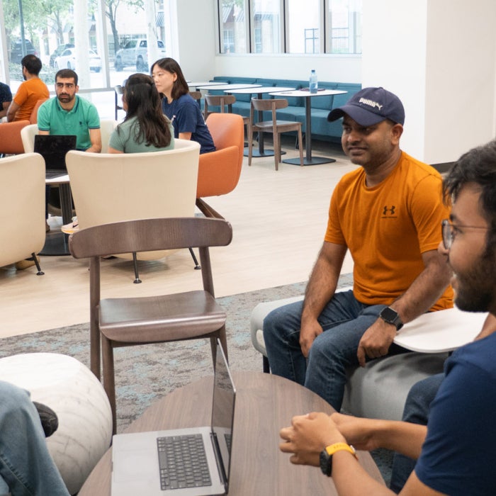 Students from different cultures dialogue together in the Texas Global lobby