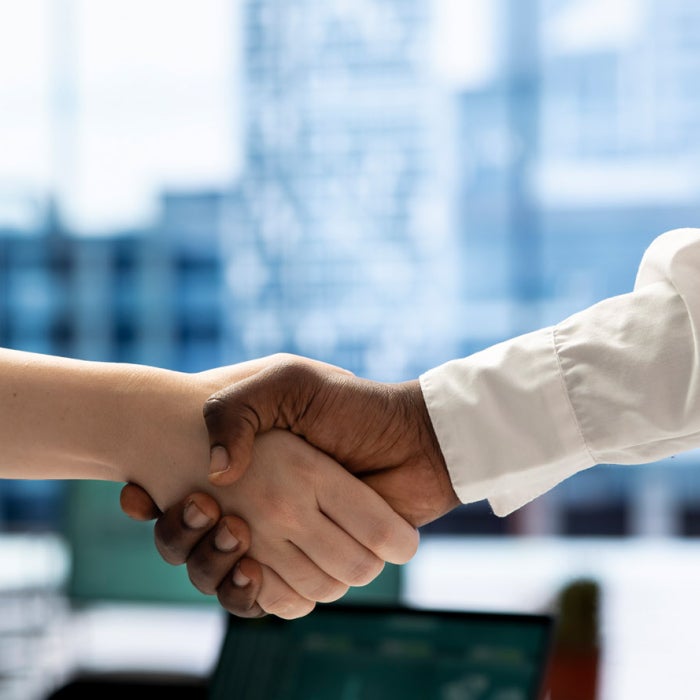 Recruiter shaking hands with person