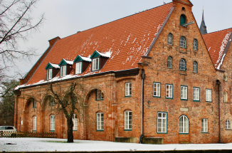 a view of a snowy river and building in germany