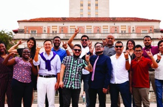 Young Leader of Americas fellows pose in front of UT tower 