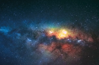 colourful galaxy in dark sky with stars