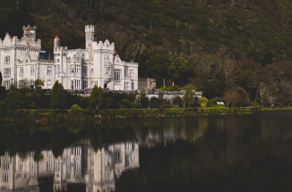 a view of a castle on a lake in ireland 