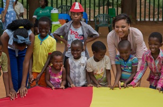 Peace Corps volunteers playing with children in Botswana