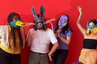 Students pose while wearing masks they made while studying in Mexico