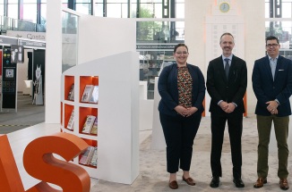 Representatives of UT Press stand proudly at their bookstand at FILUNI 2023