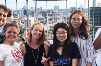 ELC teacher Dara Chambers smiles with students overlooking Austin