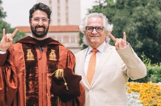 UT alumni Habib Chamoun and Antoine Chamoun Farah celebrate at the UT Tower