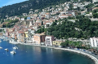 Hills rise from the ocean in the city of Nice, France