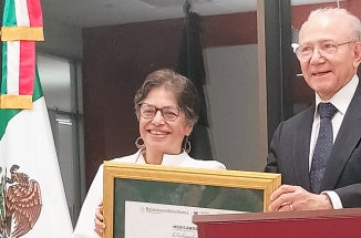 Director accepts award.