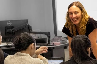 English Language Center instructor Sarah Episcopo smiles at her class