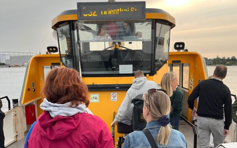 Students board a ferry in Denmark