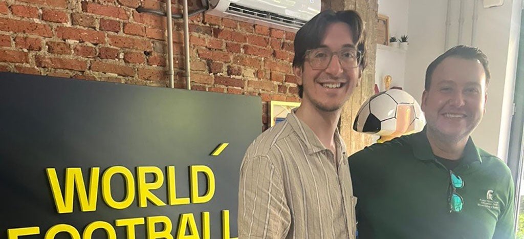 Two male participants in the Madrid, Spain program smile