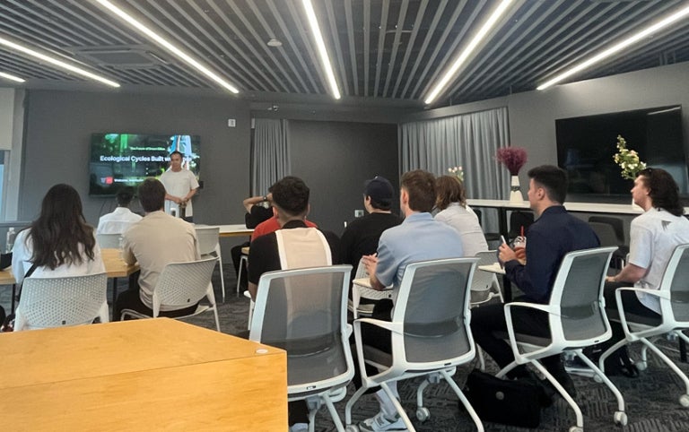 Mosslab from Absolute Internships participants sit in a modern classroom setting