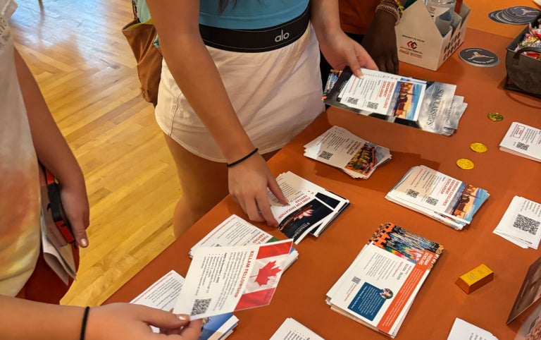 Education Abroad Fair table with study aborad program brochures and information