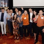 UT alumni gather in Singapore, smiling for a group photo