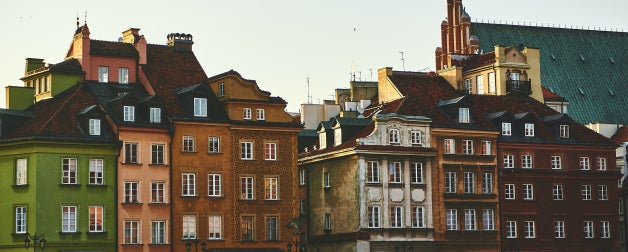 colourful tall buildings next to each other during daytime 