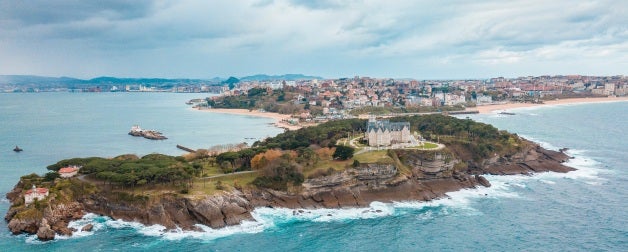 a view of the beach by the ocean in spain