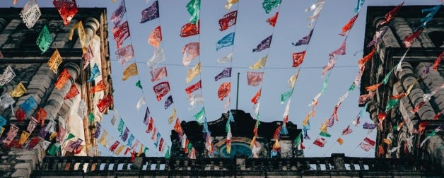 Colorful flags above a street in Mexico