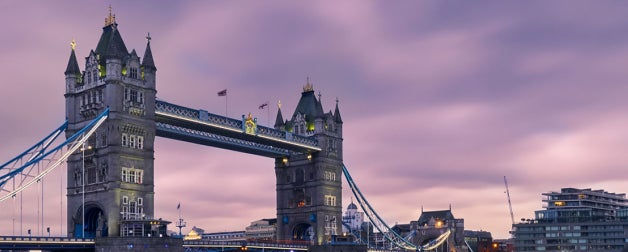 London bridge at sunset with purple cloudy sky