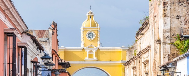 A bright yellow archway in Antigua, Guatemala