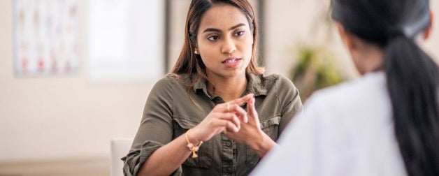 An advisor assists a student
