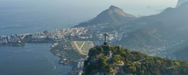 The beautiful coastal city of Rio di Janiero as seen from an aerial vantage point on sunny and hazy morning with the towering Christ the Redeemer statue in view