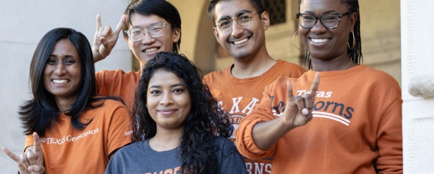 Smiling UT students show off their longhorn pride