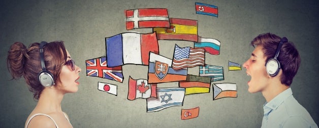 Young woman and man in headphones learning different languages communicating through simultaneous interpretation