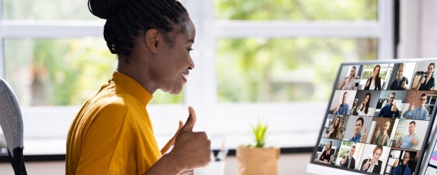 Girl giving thumbs up on a virtual meeting