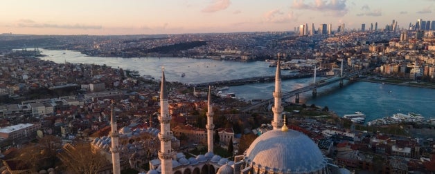 Aerial view of Suleymaniye Mosque, the river, and the city of Istanbul Turkey during sunset