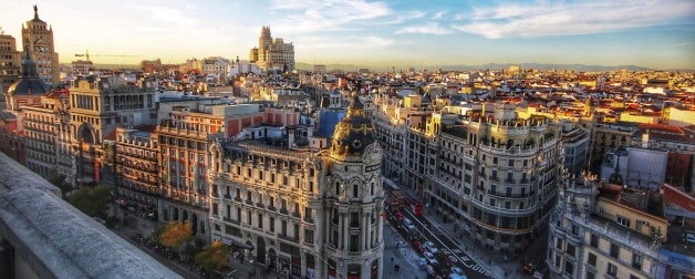 The famous street of Gran Via, surrounded by incredible architecture, shown during the day in Madrid, Spain.