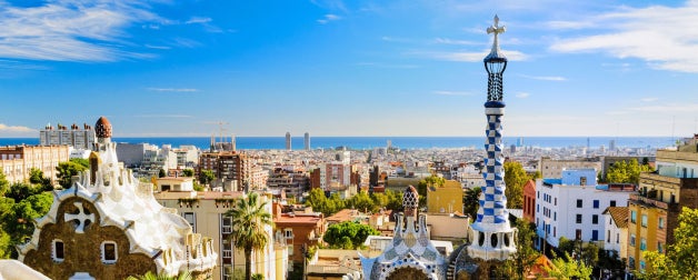 Panoramic view of the colorful city of Barcelona, Spain backdropped by blue skies during the day
