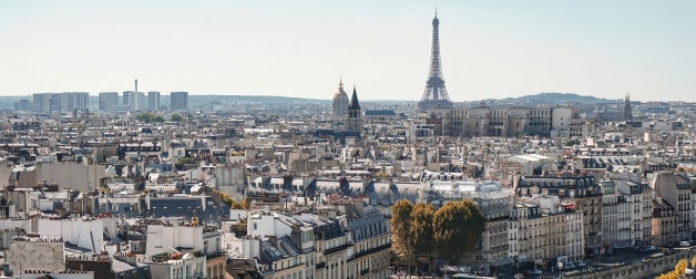 Aerial view of the city of Paris with the Eiffel Tower in view in the background