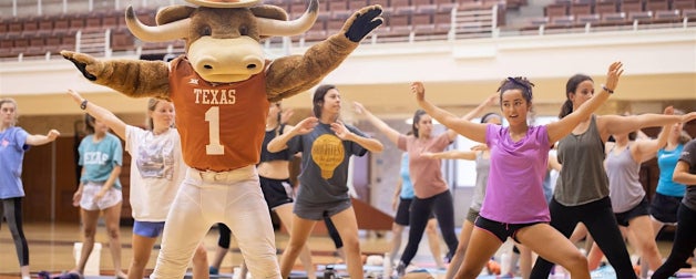 Hook 'Em Participating in Mat Pilates with Students
