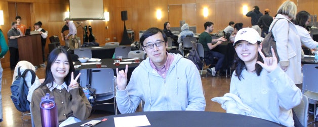 ELC students smiling and celebrating at final reception event