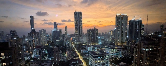 The city skyline of Mumbai, India during sunset at twilight